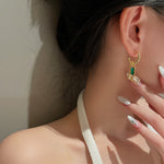 Load image into Gallery viewer, Emerald Baguette Mini Hoop Earrings
